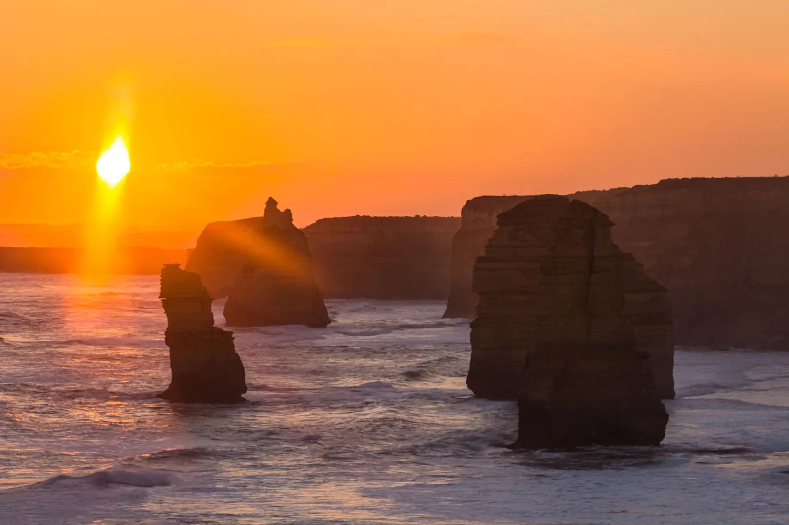 Twelve Apostles limestone stacks at sunset on the Victorian coast — Victoria solar and battery rebate information
