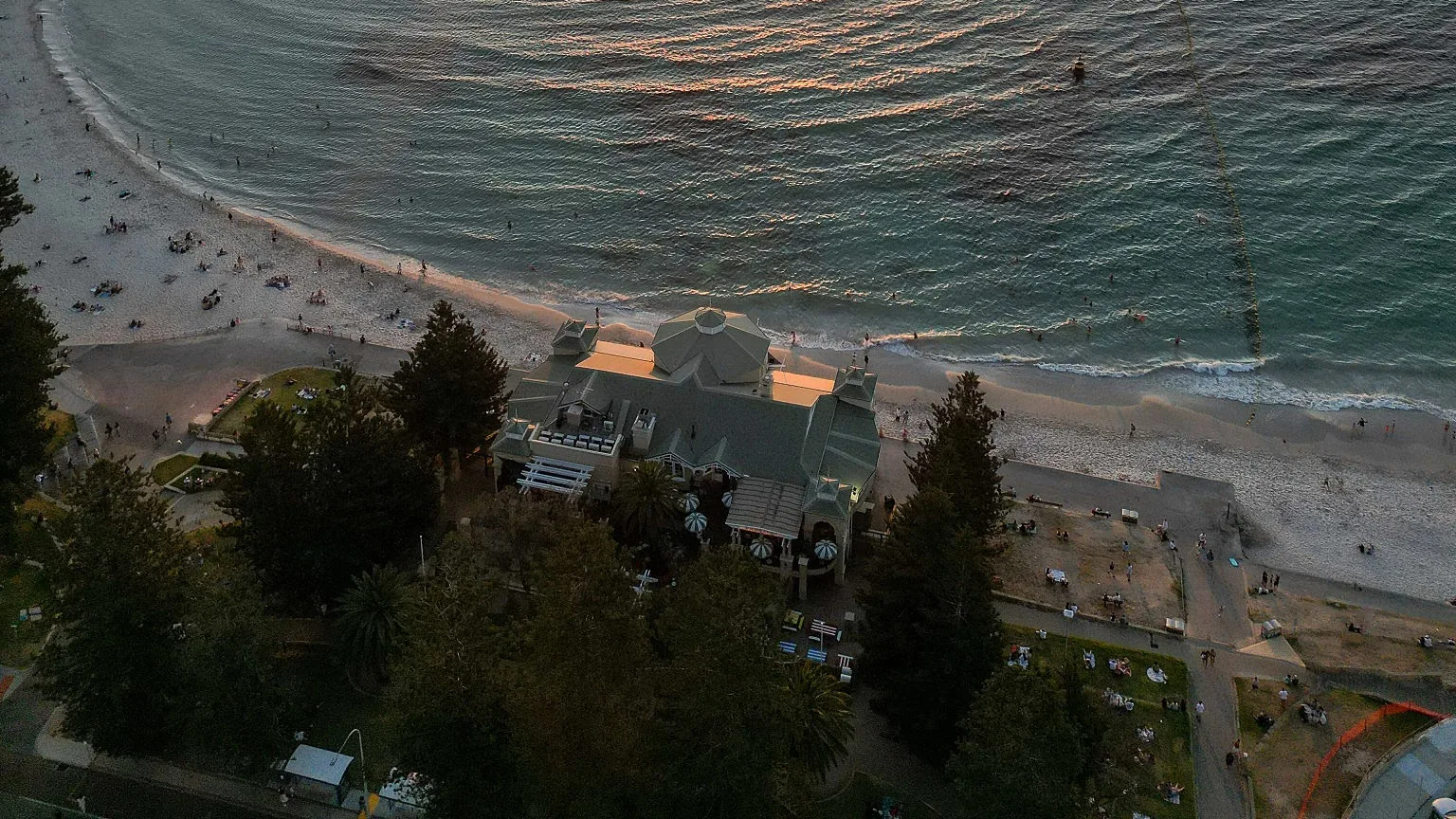 Aerial sunset over Cottesloe Beach and the Indiana Teahouse, Perth — Western Australia solar and battery rebate information